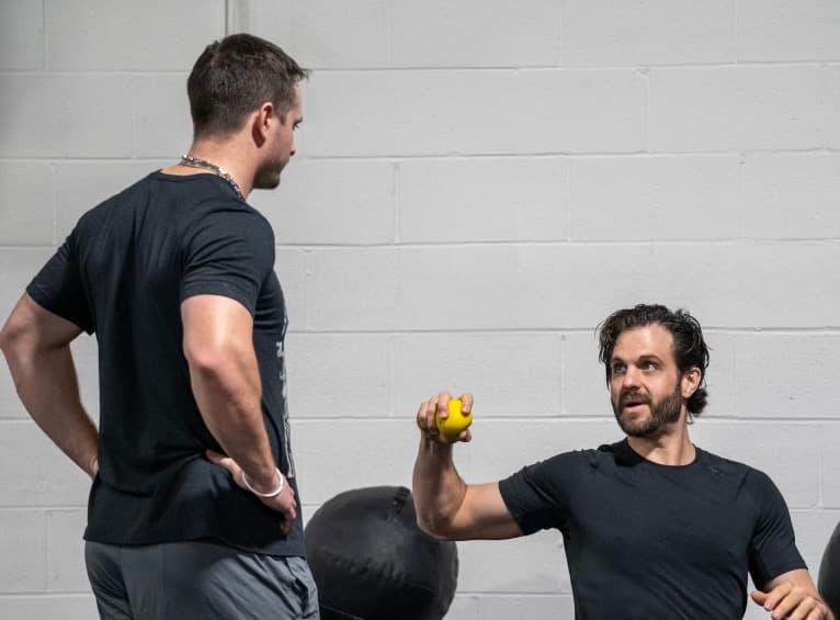 Movement Medicine clinician working with an athlete during sports rehab in Atlanta